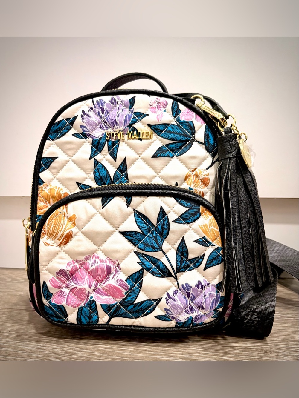 Steve Madden Cream Floral Quilted Mini Backpack with Black Trim